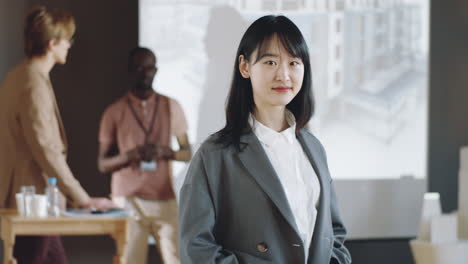 Portrait-of-Young-Asian-Woman-on-Business-Conference